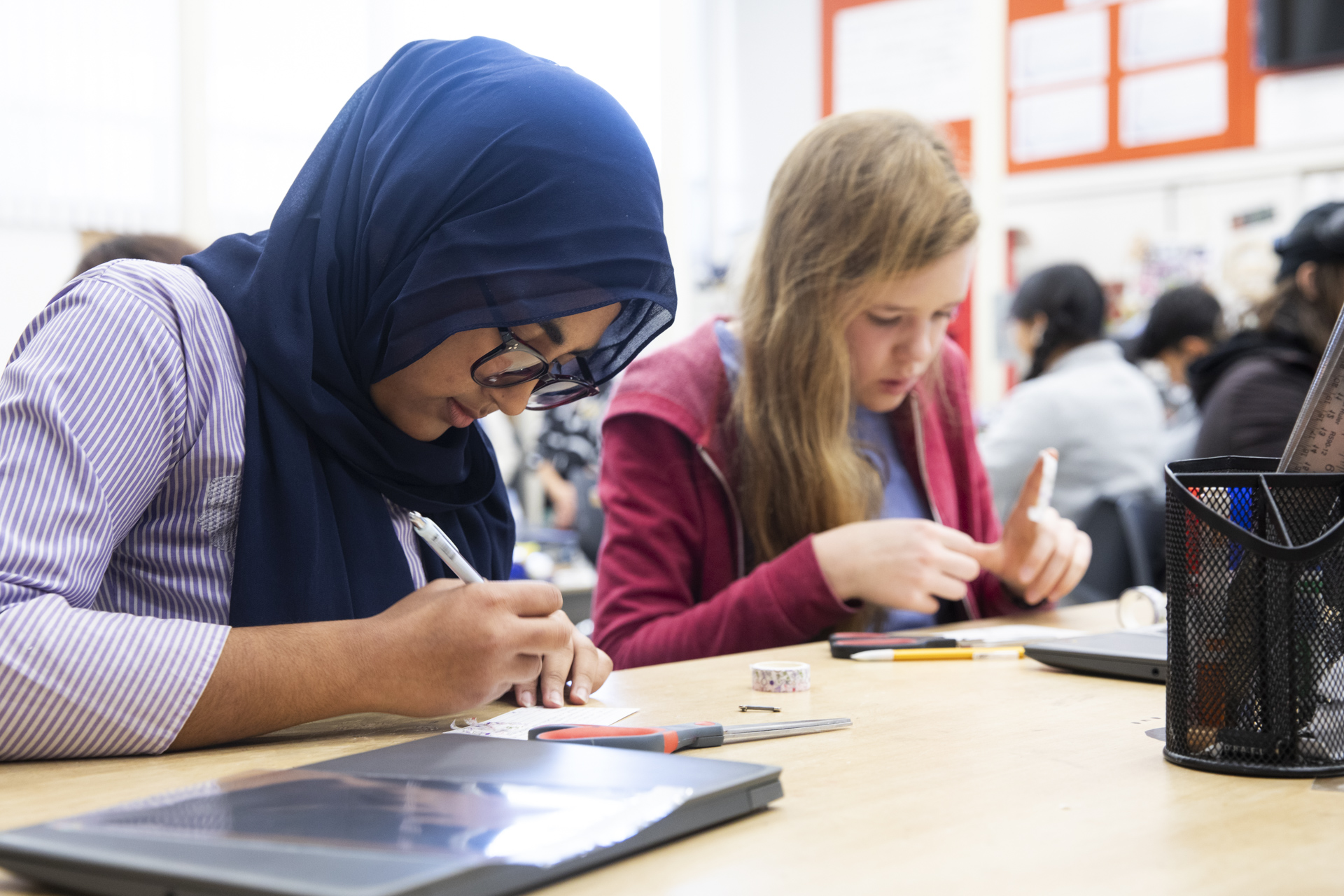 Students work on art projects related to STEM. 