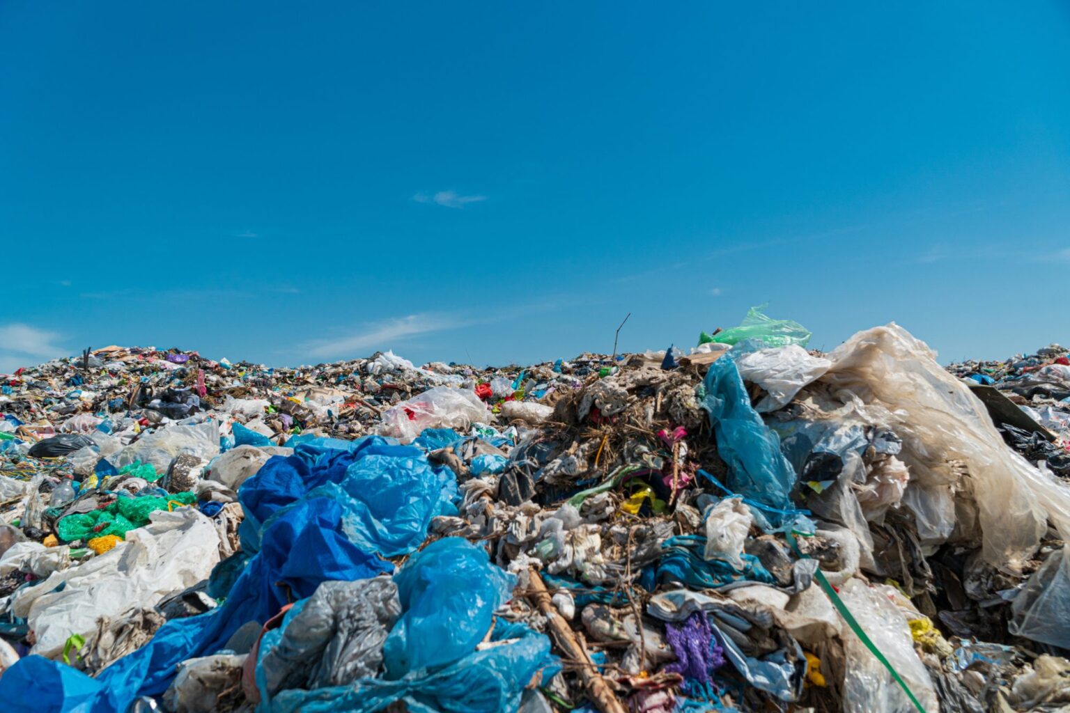 New tool can track the environmental impact of our consumption habits Environmental disaster. Landfill. Plastic scrap in landfill. City garbage