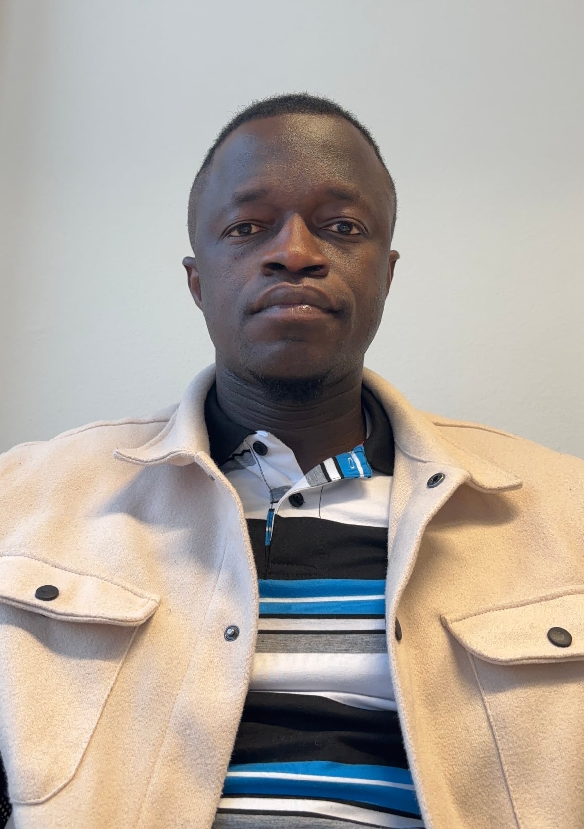 A man stares at the camera for a photo.