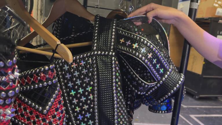 Six the Musical's Chelsea Dawson shows off the cast's bedazzled costumes.