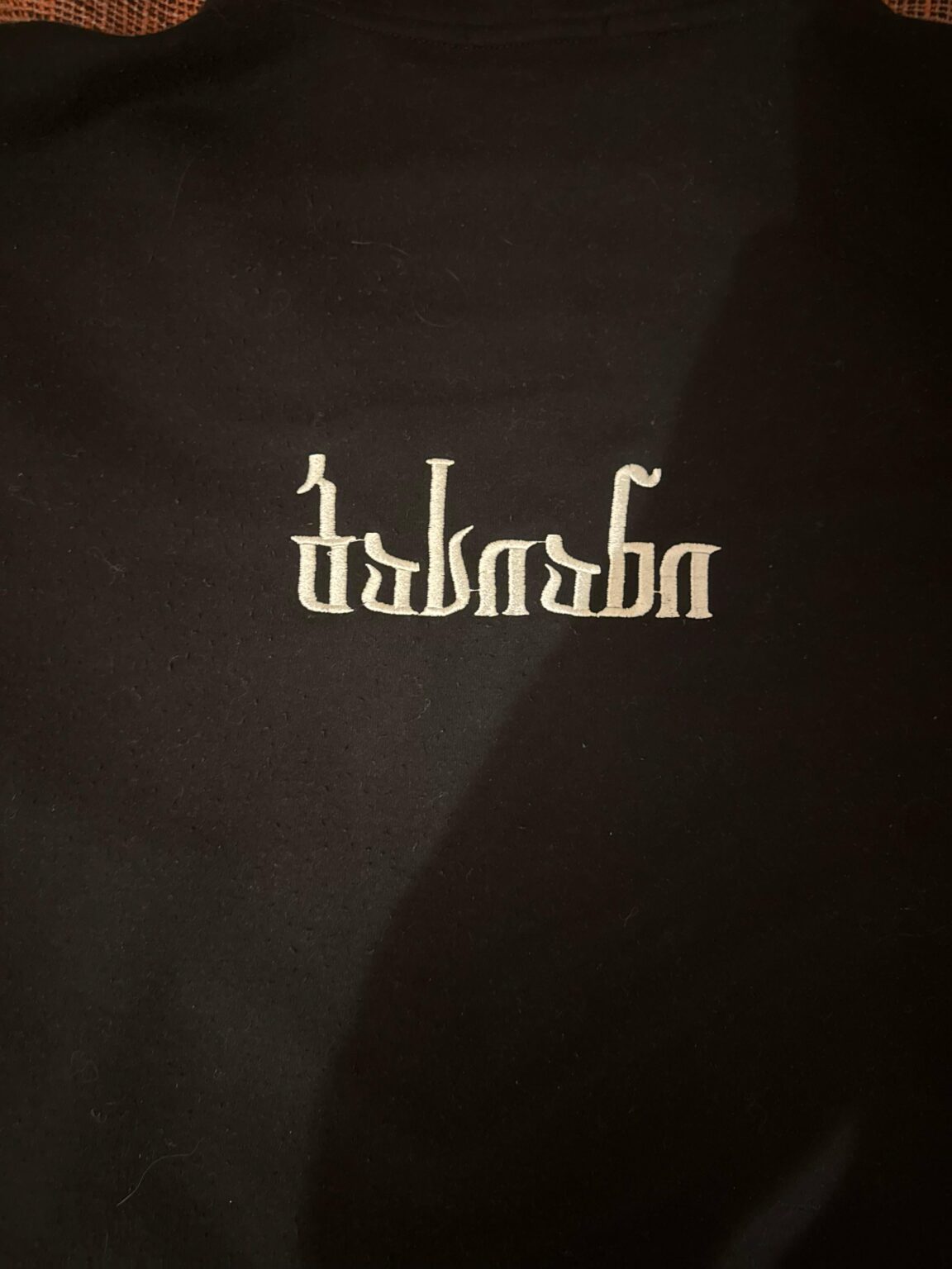 What does this say? It’s a hoodie from Bassiani