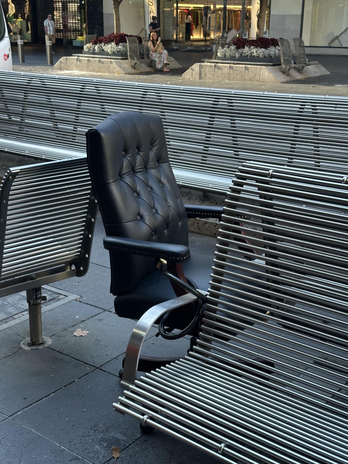 Office chair bike locked to seat on Bourke Street