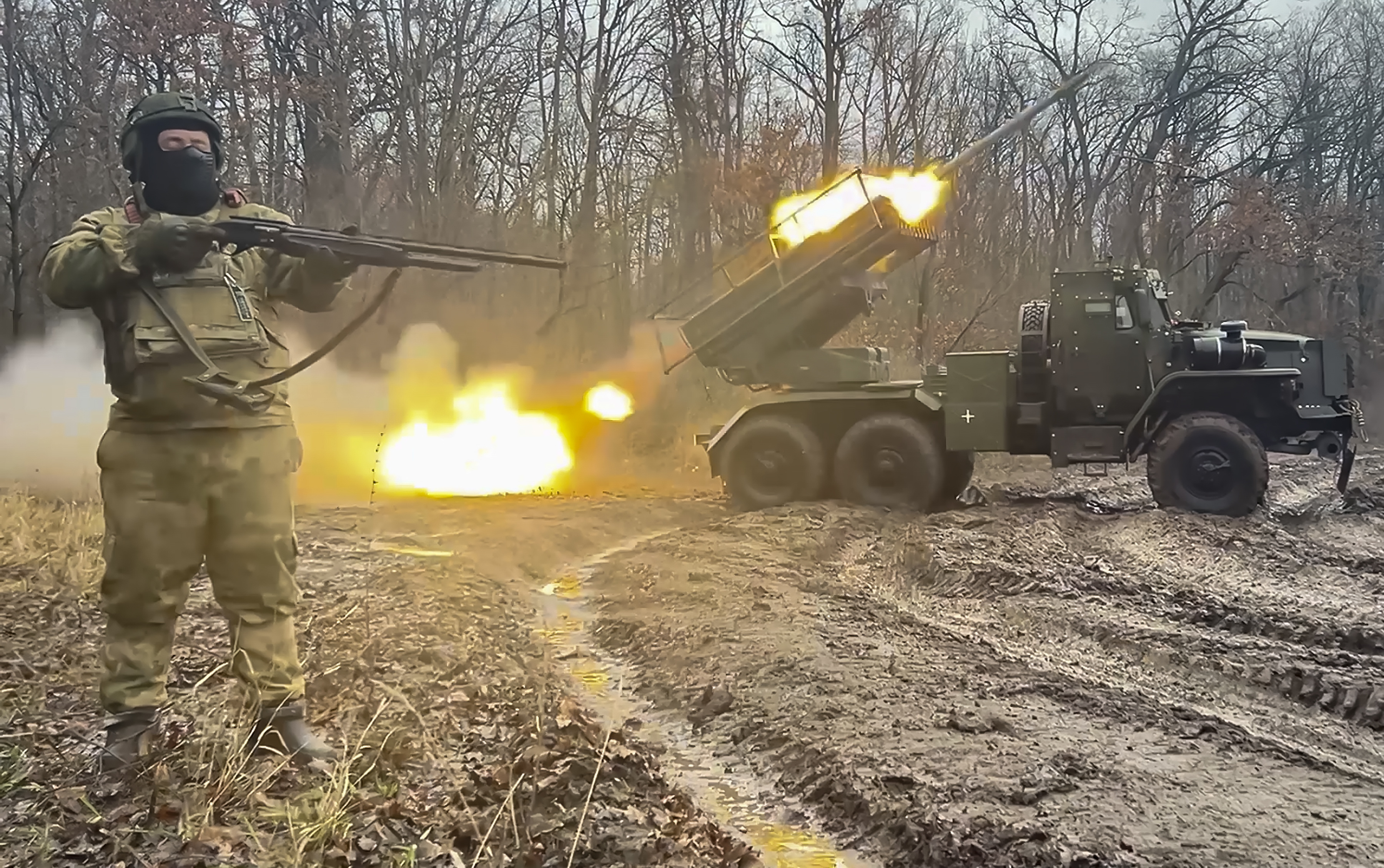 Russian soldiers launch rockets as fighting in Kursk continues