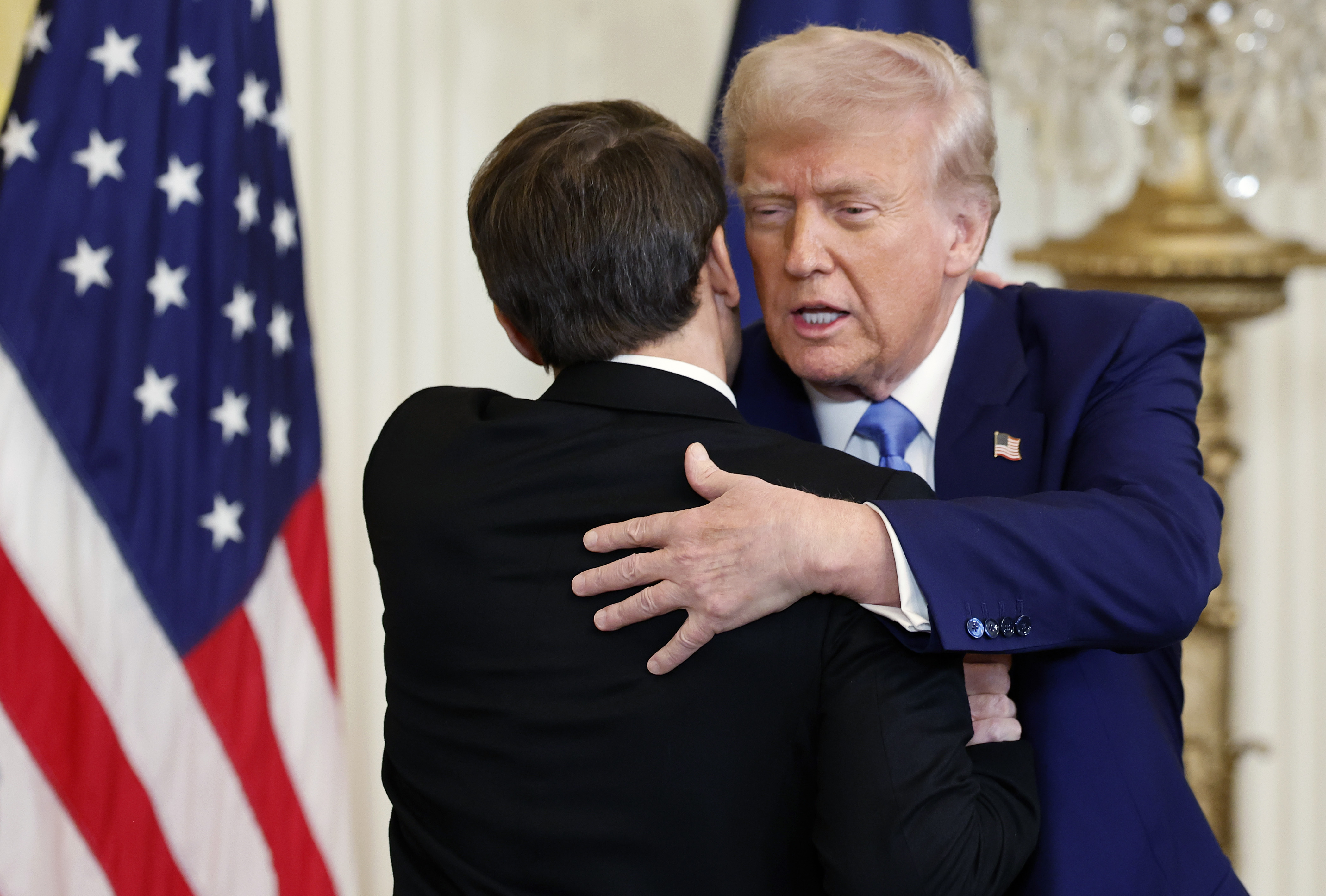 The leaders embrace at the end of the press conference on Monday afternoon