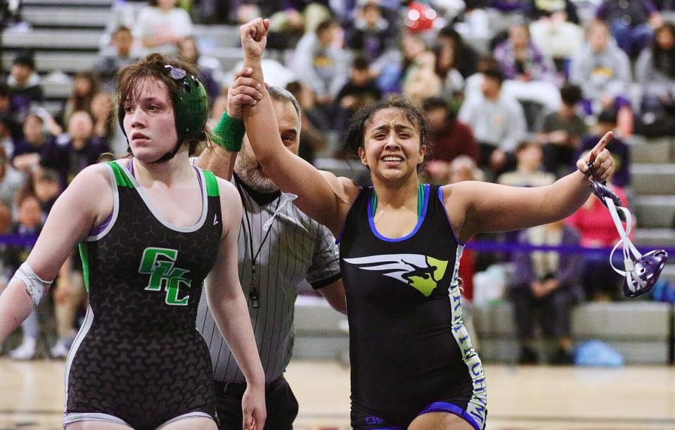 Birmingham's Elizabeth Reyes celebrates, right, after pinning Granada Hills' Maya Magana.