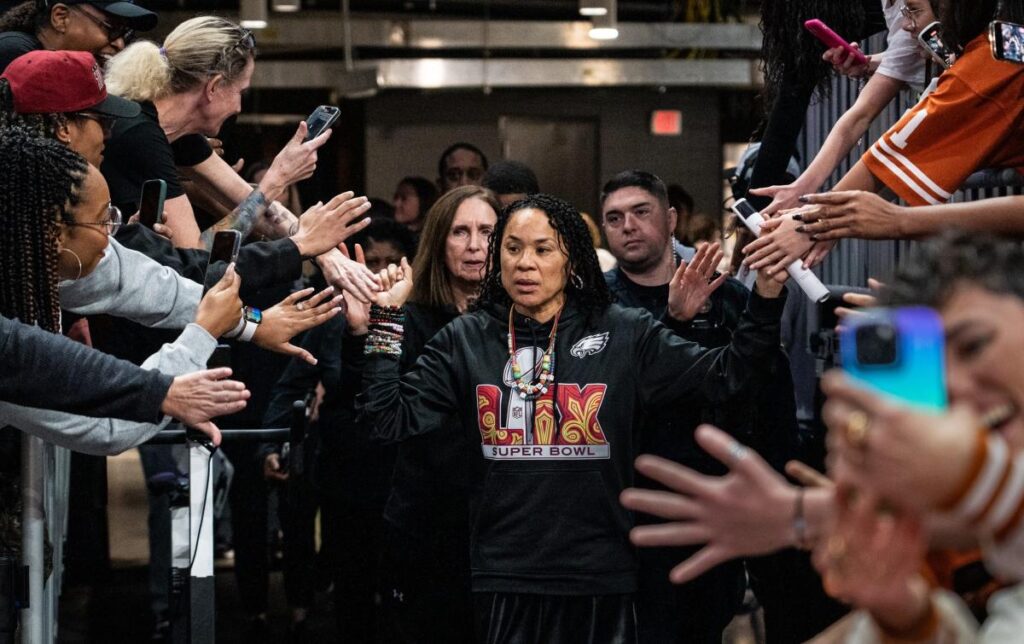 South Carolina women's basketball coach Dawn Staley shows Eagles pride on sidelines
