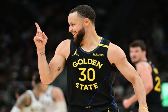Golden State Warriors guard Stephen Curry reacts in the fourth quarter of a February game against the Milwaukee Bucks.
