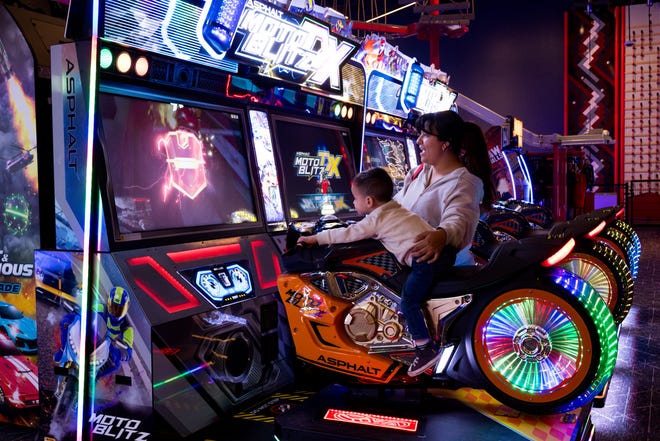 A mom and her son play games at Gamescape, El Paso’s new all-ages entertainment spot by Cinemark, on Friday, Feb. 21, 2025.
