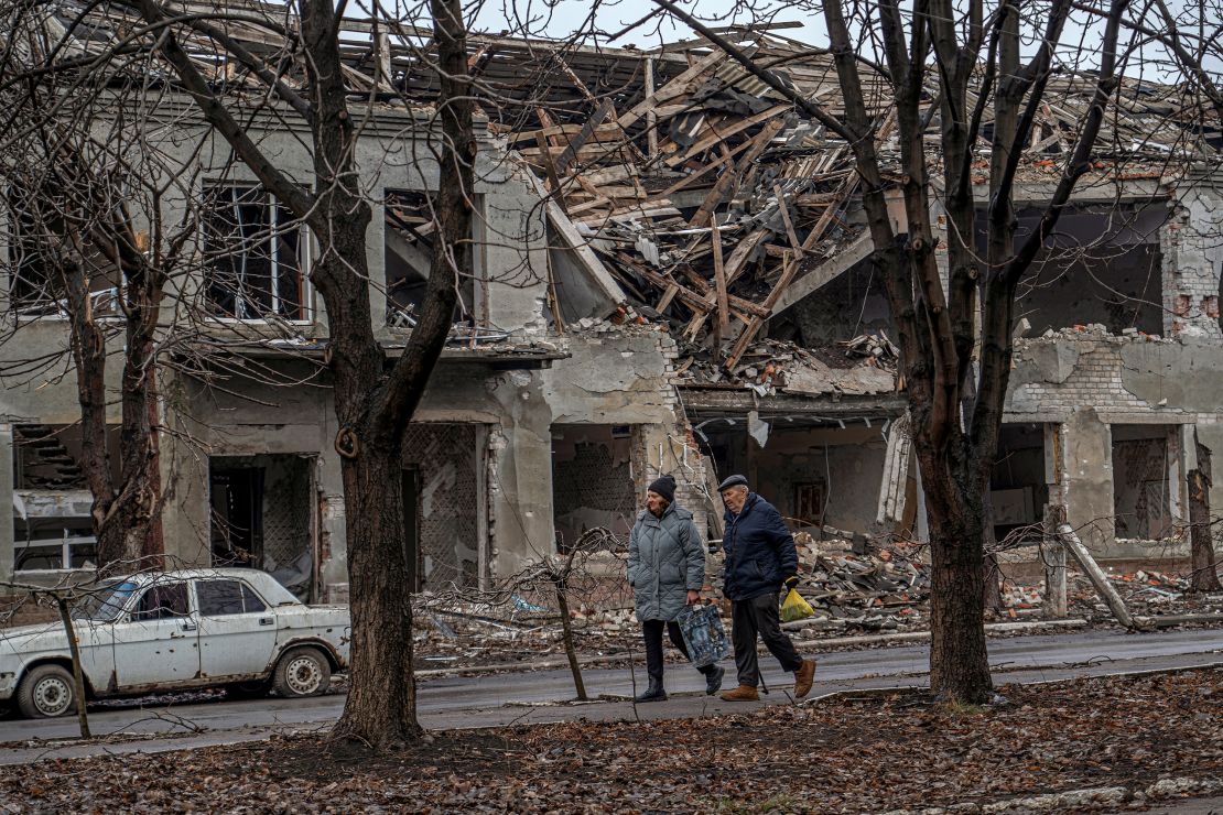 Residents walk past a building damaged by Russian military strikes in Pokrovsk, Ukraine, on January 25.