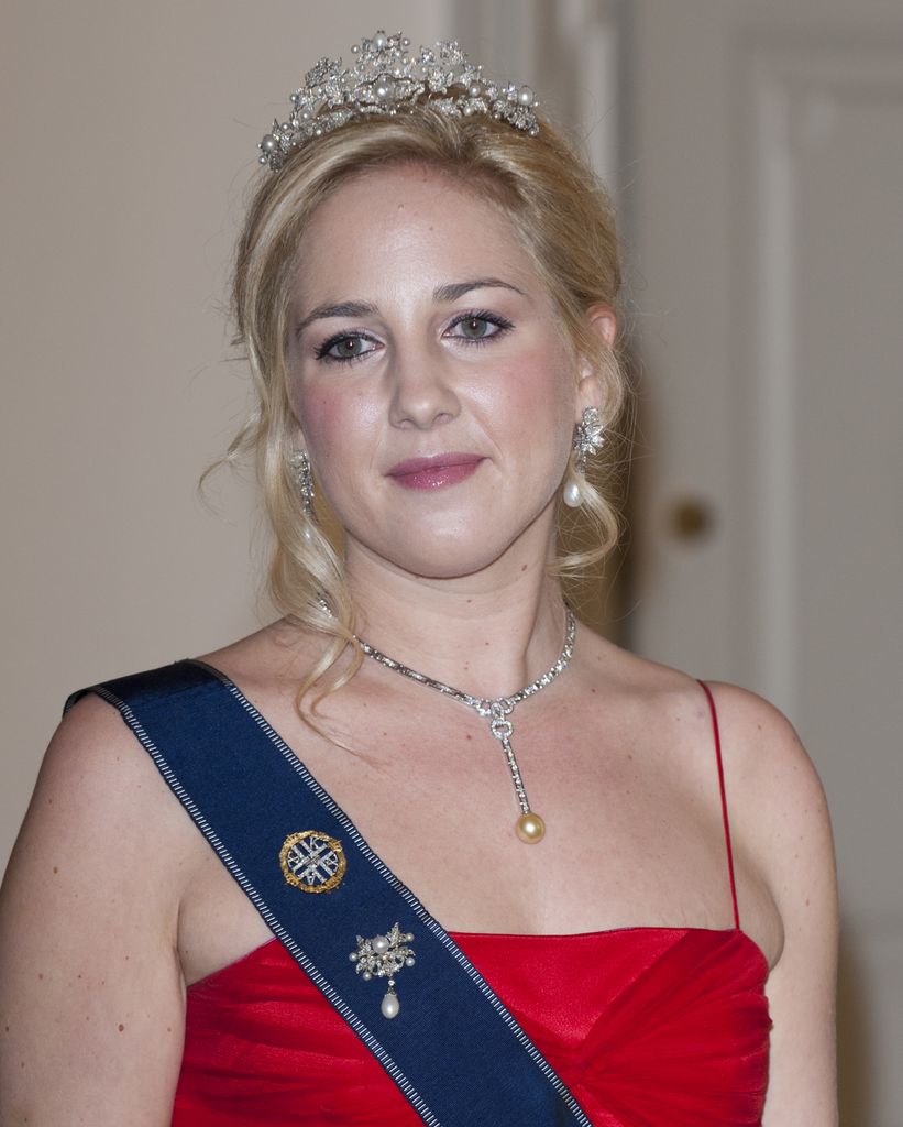 Princess Theodora in red dress and tiara
