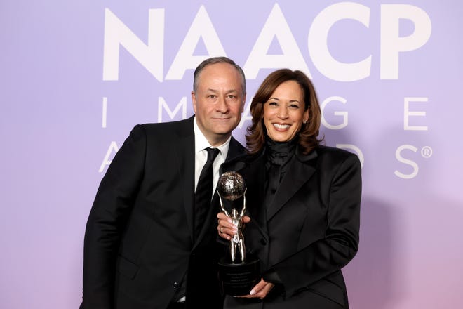 Doug Emhoff, left, and Kamala Harris attend the NAACP Image Awards on Feb. 22, 2025.