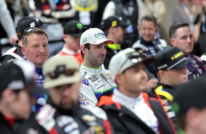 HAMPTON, GEORGIA - FEBRUARY 23: Daniel Suarez, driver of the #99 Freeway Insurance Chevrolet, (C) attends the Drivers Meeting prior to the NASCAR Cup Series Ambetter Health 400 at Atlanta Motor Speedway on February 23, 2025 in Hampton, Georgia. (Photo by Jonathan Bachman/Getty Images)
