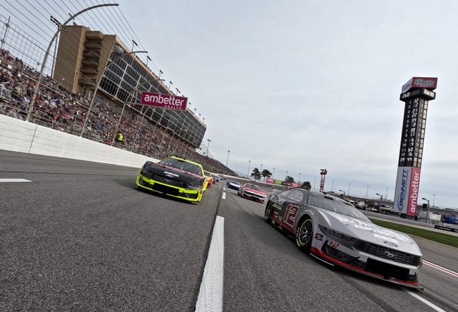 HAMPTON, GEORGIA - FEBRUARY 23: Ryan Blaney, driver of the #12 BodyArmor Zero Sugar Ford, and Austin Cindric, driver of the #2 Menards/Delta Ford, lead the field on a pace lap prior to the NASCAR Cup Series Ambetter Health 400 at Atlanta Motor Speedway on February 23, 2025 in Hampton, Georgia. (Photo by Jonathan Bachman/Getty Images)