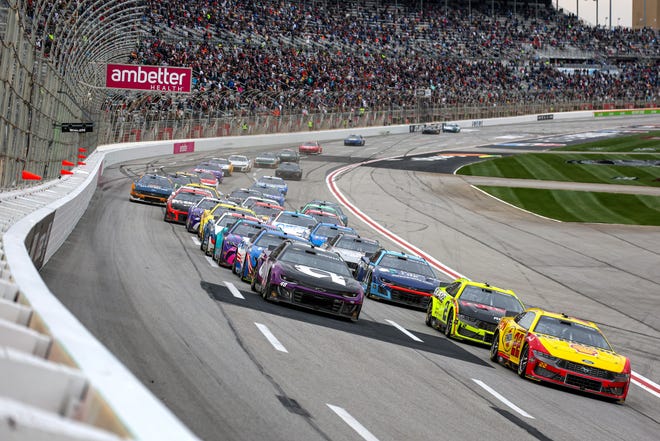 HAMPTON, GEORGIA - FEBRUARY 23: Joey Logano, driver of the #22 Shell Pennzoil Ford, Austin Cindric, driver of the #2 Menards/Delta Ford, and Alex Bowman, driver of the #48 Ally Chevrolet, race during the NASCAR Cup Series Ambetter Health 400 at Atlanta Motor Speedway on February 23, 2025 in Hampton, Georgia. (Photo by Chris Graythen/Getty Images)