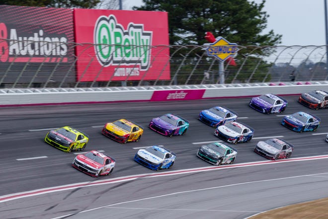 Feb 23, 2025; Hampton, Georgia, USA; Josh Berry (21) fights to maintain the lead going into turn four at Atlanta Motor Speedway. Mandatory Credit: Jason Allen-Imagn Images