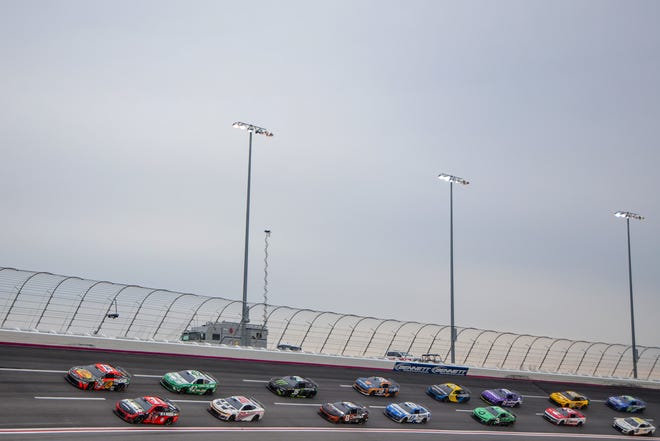 HAMPTON, GEORGIA - FEBRUARY 23: Ross Chastain, driver of the #1 Moose Fraternity Chevrolet, and Chase Briscoe, driver of the #19 Bass Pro Shops Toyota, race during the NASCAR Cup Series Ambetter Health 400 at Atlanta Motor Speedway on February 23, 2025 in Hampton, Georgia. (Photo by Jonathan Bachman/Getty Images)