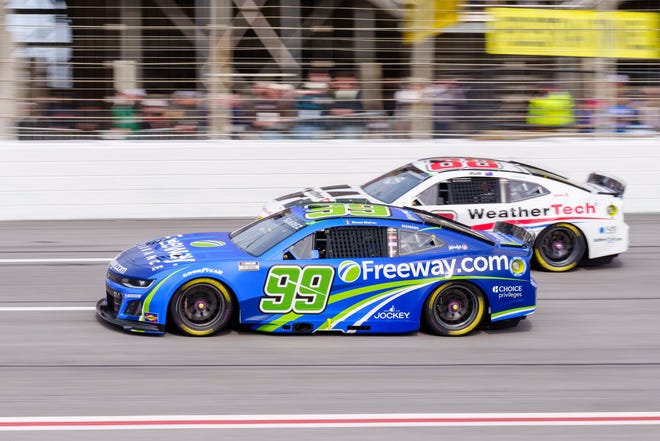 Feb 23, 2025; Hampton, Georgia, USA; Daniel Suarez (99) comes through turn four at Atlanta Motor Speedway. Mandatory Credit: Jason Allen-Imagn Images