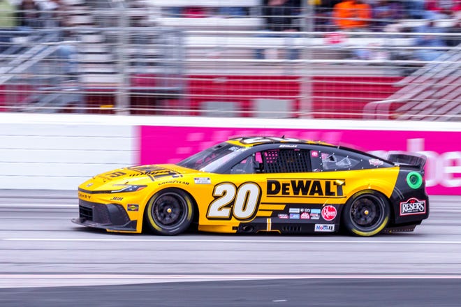 Feb 23, 2025; Hampton, Georgia, USA; Christopher Bell (20) goes into turn one at Atlanta Motor Speedway. Mandatory Credit: Jason Allen-Imagn Images