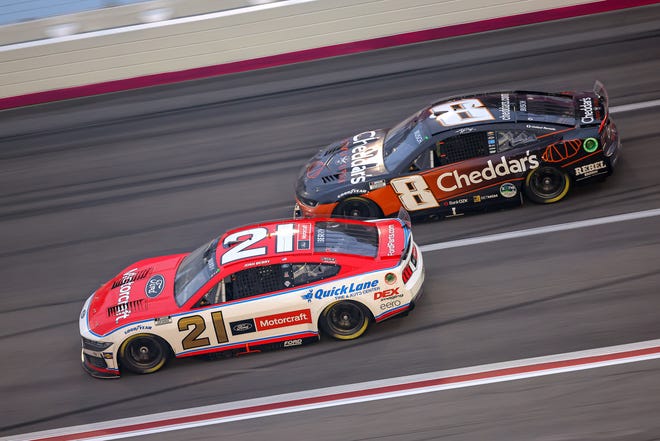 HAMPTON, GEORGIA - FEBRUARY 23: Josh Berry, driver of the #21 Motorcraft/Quick Lane Ford, and Kyle Busch, driver of the #8 Cheddar's Scratch Kitchen Chevrolet, race during the NASCAR Cup Series Ambetter Health 400 at Atlanta Motor Speedway on February 23, 2025 in Hampton, Georgia. (Photo by Jonathan Bachman/Getty Images)