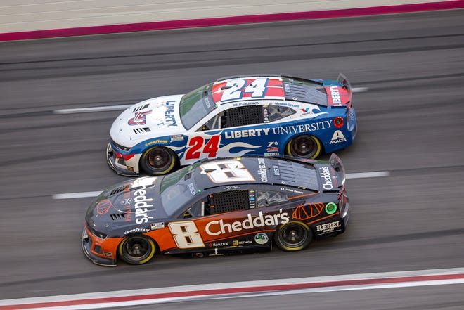 HAMPTON, GEORGIA - FEBRUARY 23: Kyle Busch, driver of the #8 Cheddar's Scratch Kitchen Chevrolet, and William Byron, driver of the #24 Liberty University Chevrolet, race during the NASCAR Cup Series Ambetter Health 400 at Atlanta Motor Speedway on February 23, 2025 in Hampton, Georgia. (Photo by Jonathan Bachman/Getty Images)