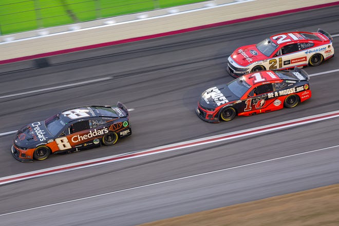 HAMPTON, GEORGIA - FEBRUARY 23: Kyle Busch, driver of the #8 Cheddar's Scratch Kitchen Chevrolet, Ross Chastain, driver of the #1 Moose Fraternity Chevrolet, and Josh Berry, driver of the #21 Motorcraft/Quick Lane Ford, race during the NASCAR Cup Series Ambetter Health 400 at Atlanta Motor Speedway on February 23, 2025 in Hampton, Georgia. (Photo by Jonathan Bachman/Getty Images)