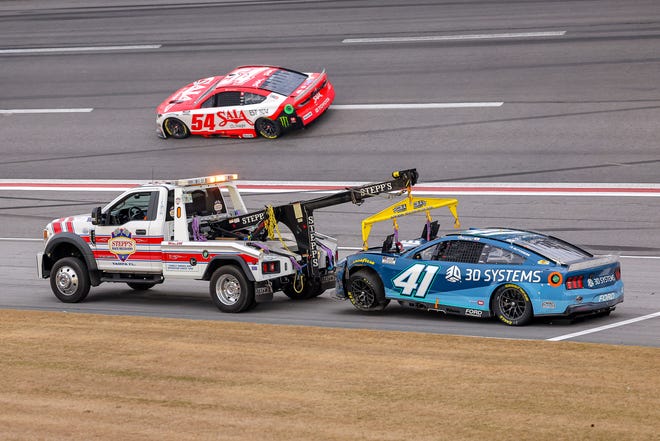 HAMPTON, GEORGIA - FEBRUARY 23: The #41 3D Systems Ford, driven by Cole Custer is towed after an on-track incident during the NASCAR Cup Series Ambetter Health 400 at Atlanta Motor Speedway on February 23, 2025 in Hampton, Georgia. (Photo by Jonathan Bachman/Getty Images)