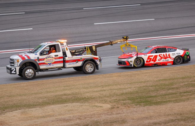 HAMPTON, GEORGIA - FEBRUARY 23: The #54 SAIA LTL Freight Toyota, driven by Ty Gibbs is towed after an on-track incident during the NASCAR Cup Series Ambetter Health 400 at Atlanta Motor Speedway on February 23, 2025 in Hampton, Georgia. (Photo by Jonathan Bachman/Getty Images)