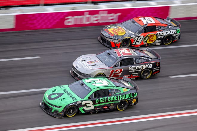 HAMPTON, GEORGIA - FEBRUARY 23: Austin Dillon, driver of the #3 Get Bioethanol Chevrolet, Ryan Blaney, driver of the #12 BodyArmor Zero Sugar Ford, and Chase Briscoe, driver of the #19 Bass Pro Shops Toyota, race during the NASCAR Cup Series Ambetter Health 400 at Atlanta Motor Speedway on February 23, 2025 in Hampton, Georgia. (Photo by Jonathan Bachman/Getty Images)