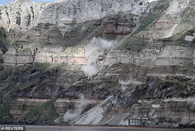 Dust rises following a landslide during high seismic activity, on the island of Santorini, Greece, February 3, 2025