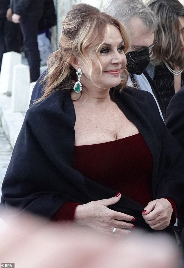 Mother of the bride Agapis Politis (left) looked proud in a gorgeous deep burgundy gown as she arrived for her daughter's big day