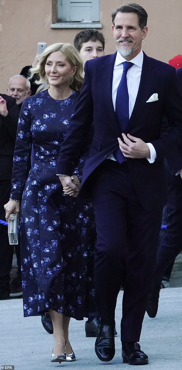 Marie-Chantal, Crown Princess of Greece (pictured, left) looked elegant as she attended the event with her husband Crown Prince Pavlos (pictured, right)