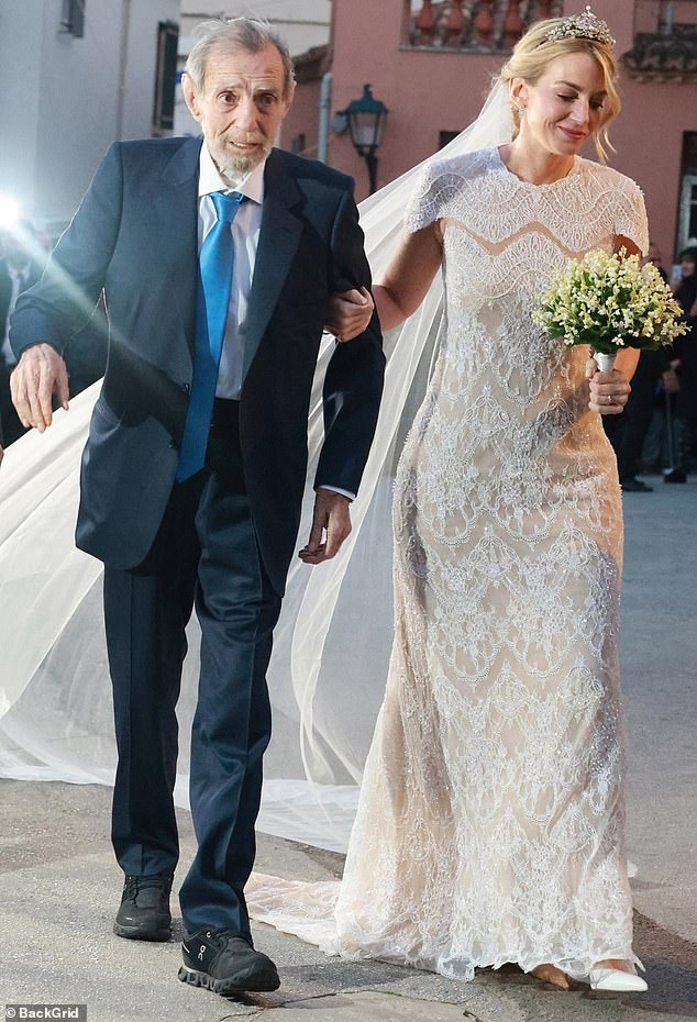 Bride Chrysí (pictured, right) stunned in an elegant cream dress at her wedding on Friday. Seen with her father, Greek shipping tycoon Yiorgos Vardinogianni (pictured, left)