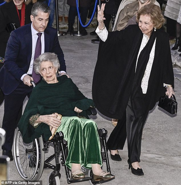 Queen Sofia of Spain (pictured, right) smiled and waved at assembled bystanders as she arrived at the event with Princess Irene of Greece (pictured, left)