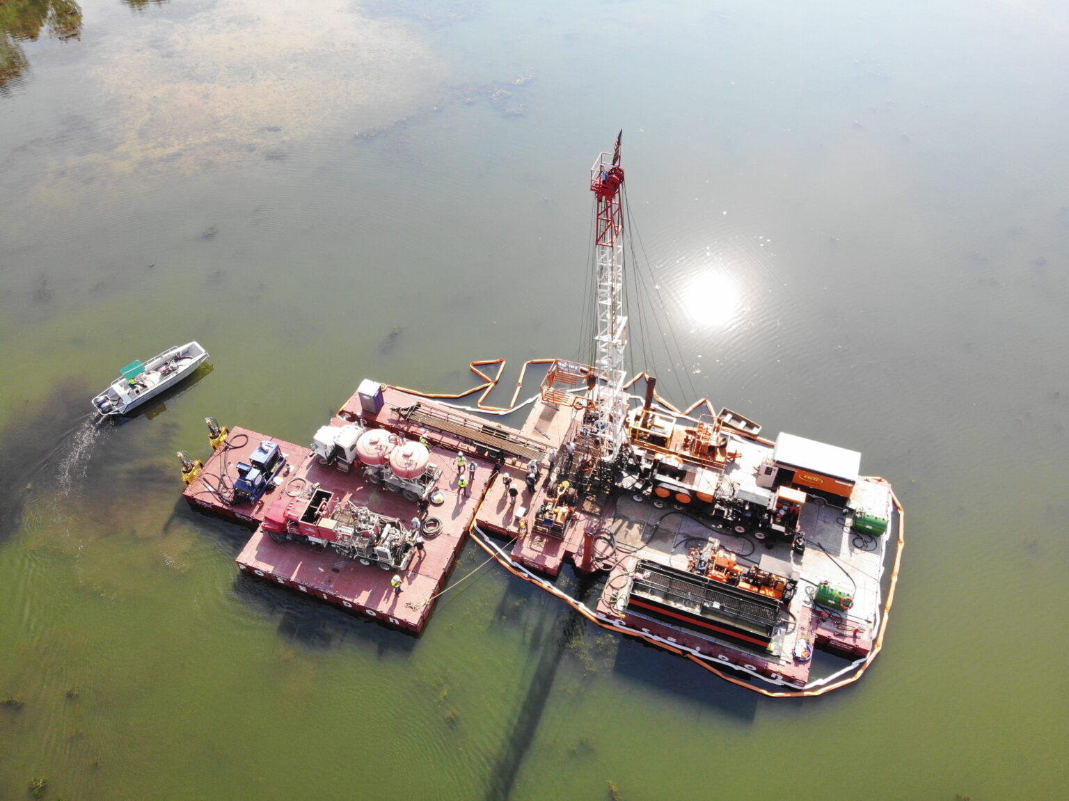 EGLE plugs two leaking wells in Ottawa County lake, only the second such operation in 30 years A barge-mounted drilling rig seals the orphaned Van Single 1 and 2 wells.