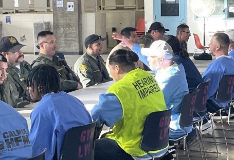 People sitting at a long table.