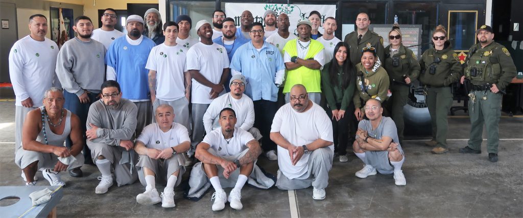 Staff and the incarcerated population group photo at California State Prison, Corcoran.