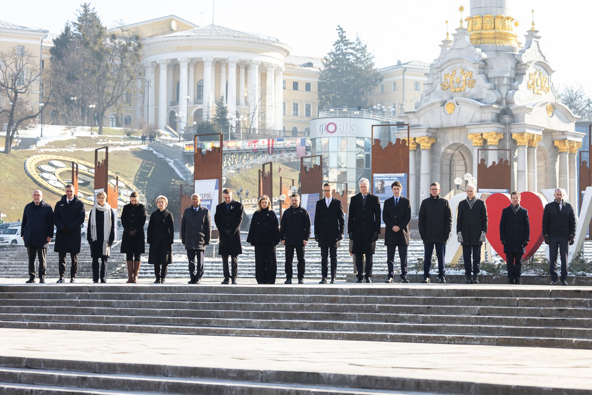 World leaders stand to mark third anniversary