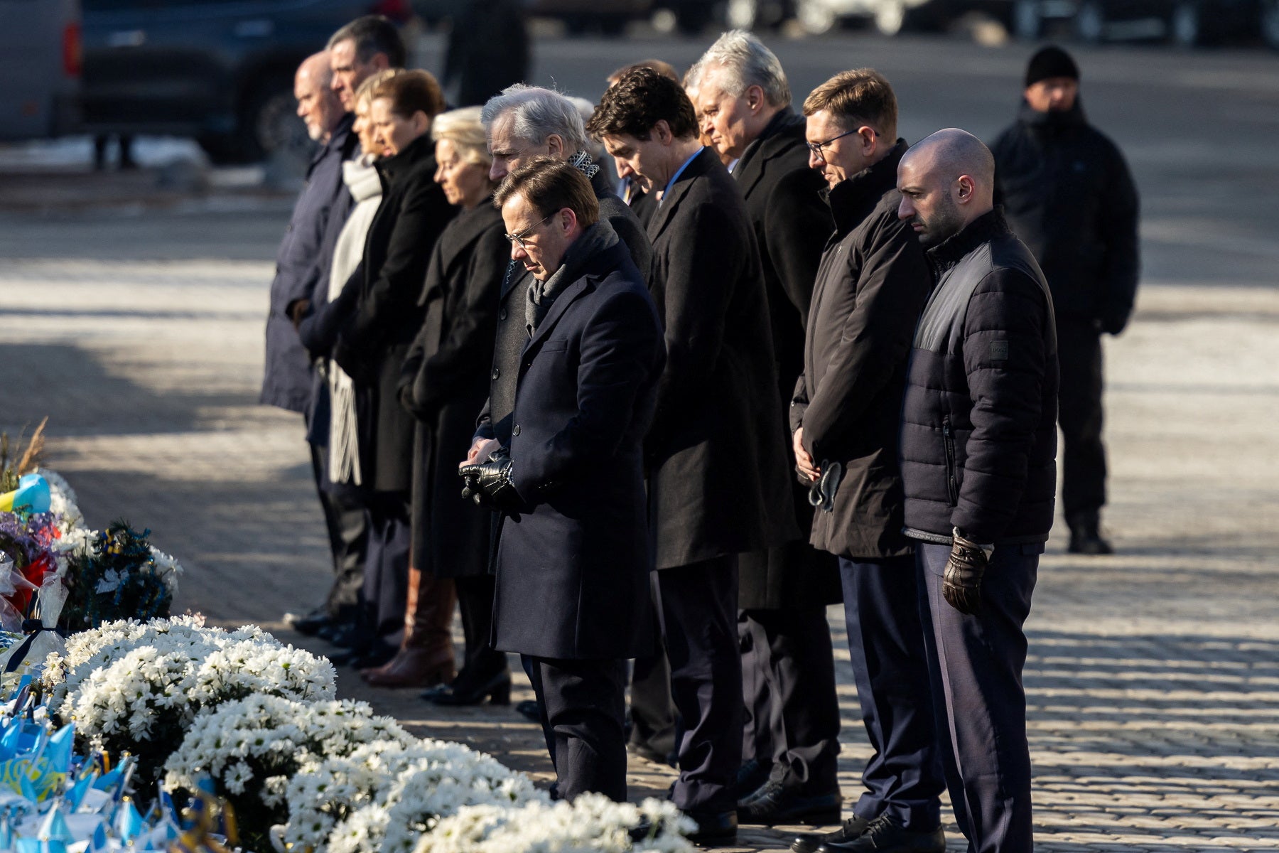 Mr Zelensky and other world leaders visit a makeshift memorial place in Kyiv