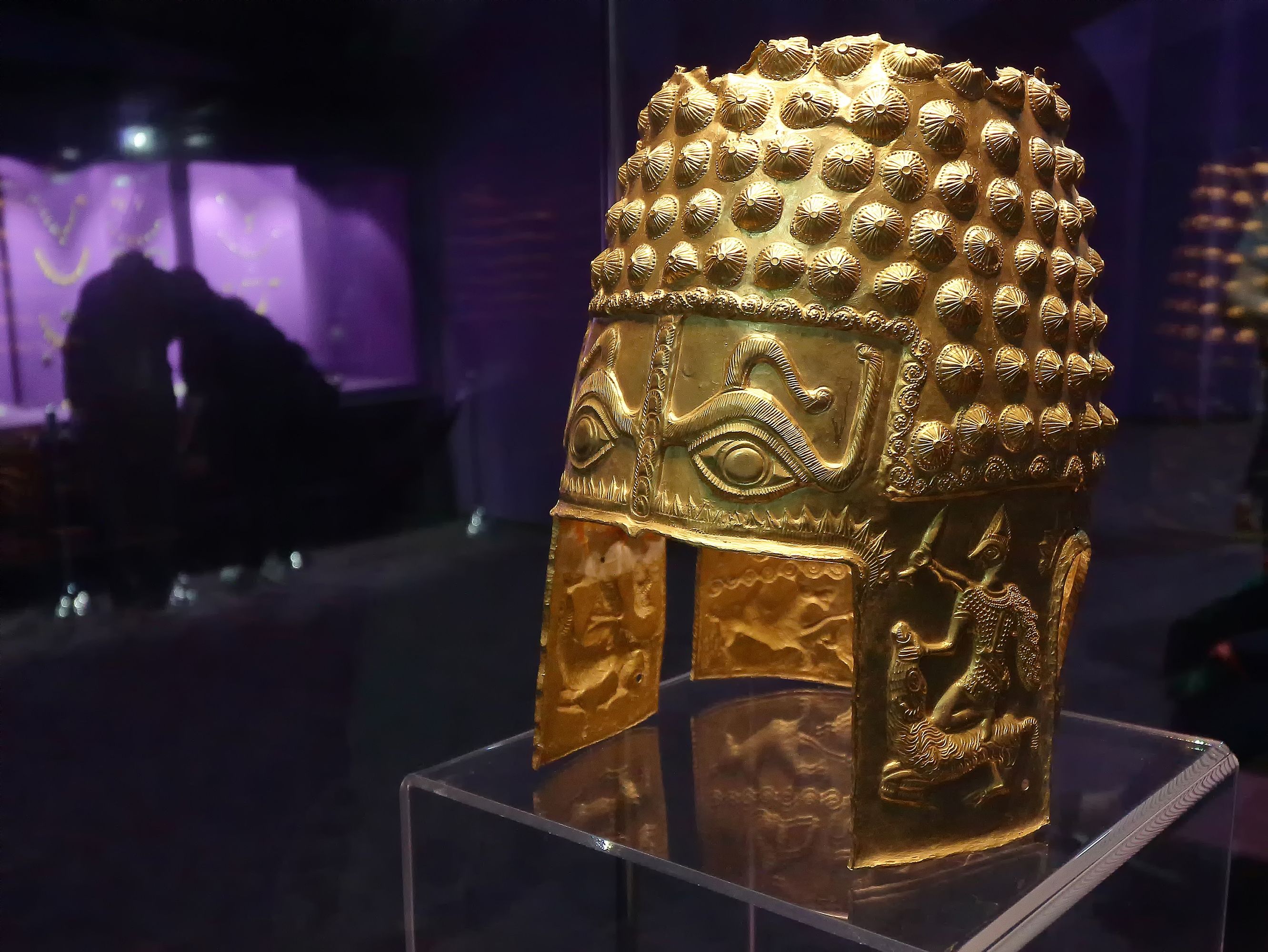 Bucharest, Romania - May 19, 2018 - The Helmet of Cotofenesti, solid gold, exhibited in the treasure hall of National Museum of Romanian History in Long Night of Museums