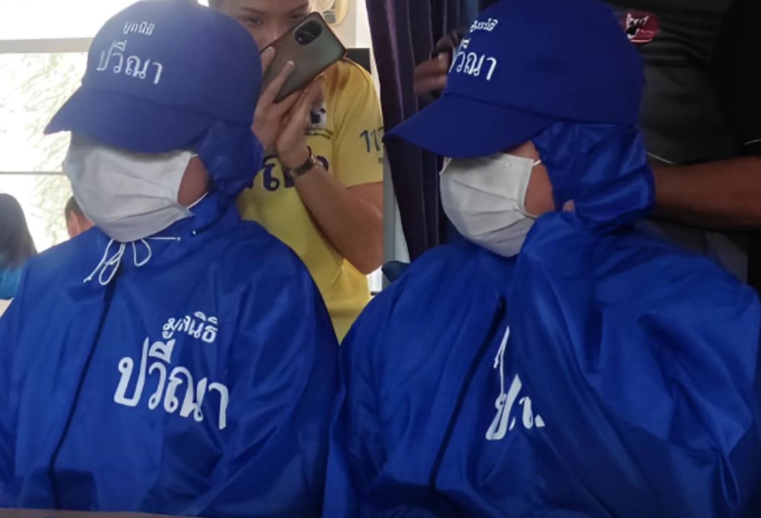 Two of the young women allegedly trafficked to Georgia are seen on their return to Thailand earlier this week. Dozens more are still believed to be captives of an “egg farm” in the former Soviet republic, according to the Pavena Hongsakul Foundation.