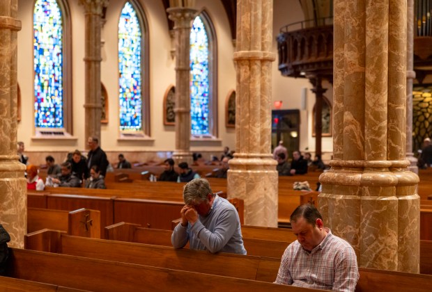 Parisioners arrive before Mass on Feb. 23, 2025, at Holy Name Cathedral in River North as Catholics around the world monitored the health of Pope Francis. (Brian Cassella/Chicago Tribune)