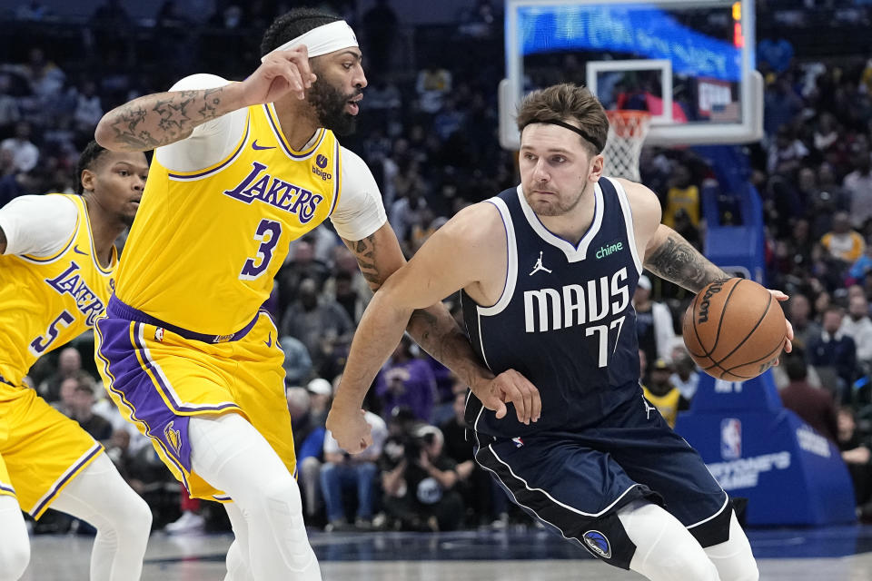 Anthony Davis and Luka Doncic are trading places after one of the most surprising deals in NBA history. (AP Photo/LM Otero, File)