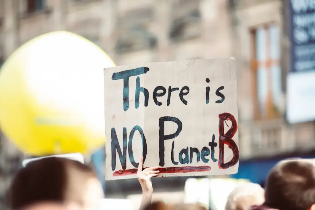 Report: Climate Change Puts Spain in Global Top 10 Risk List A protester holds a sign reading “There is NO Planet B” during a climate change demonstration.