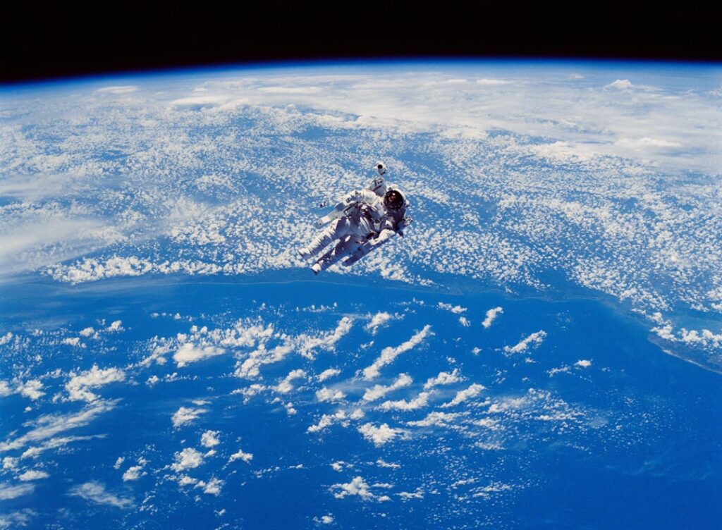 Astronaut Robert Stewart testing a Manned Maneuvering Unit (MMU). Taken on 7 and 9 February 1984.