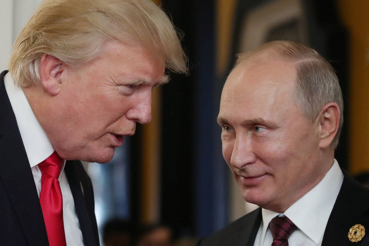  President Donald Trump chats with Putin