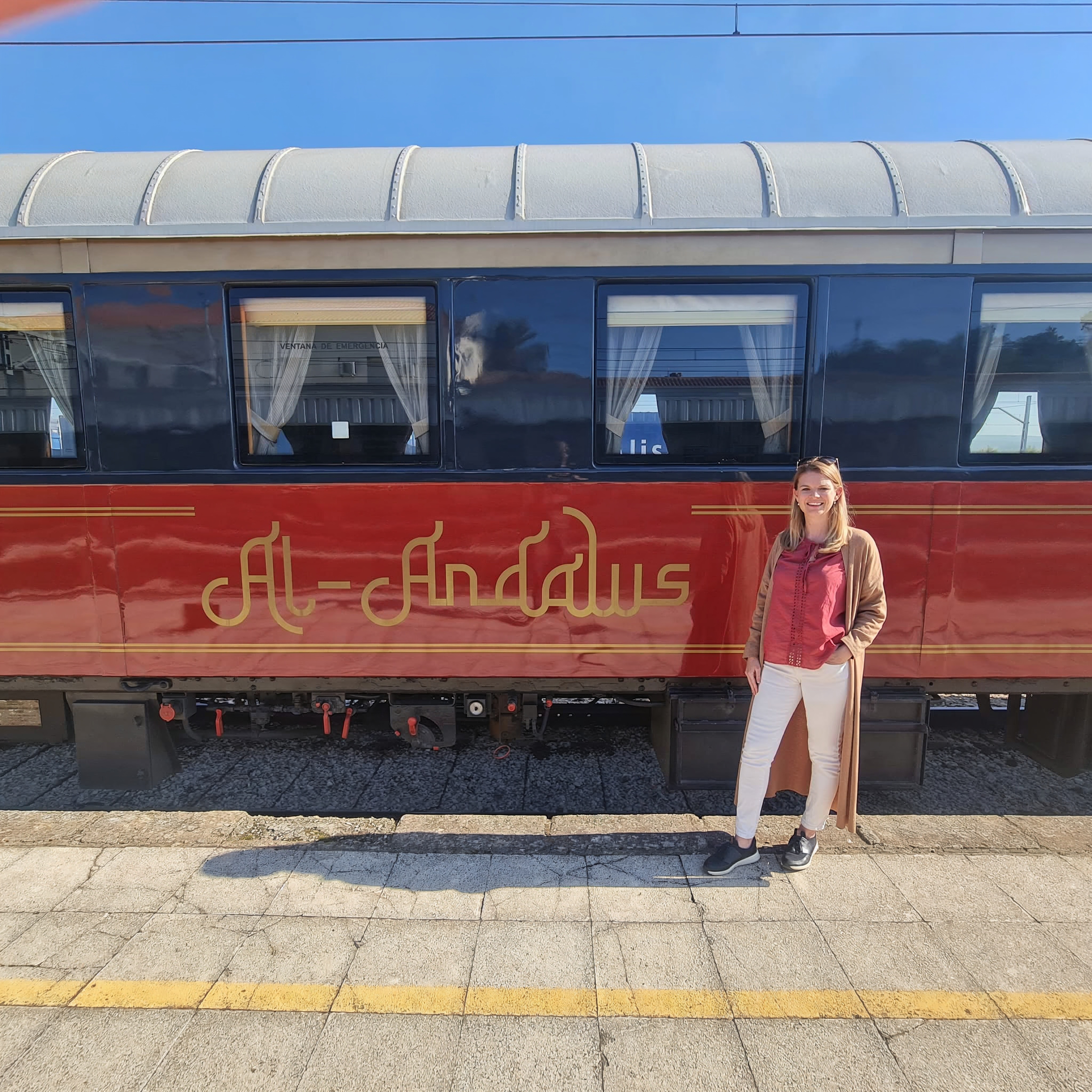 Woman standing in front of the Al-Andalus train.