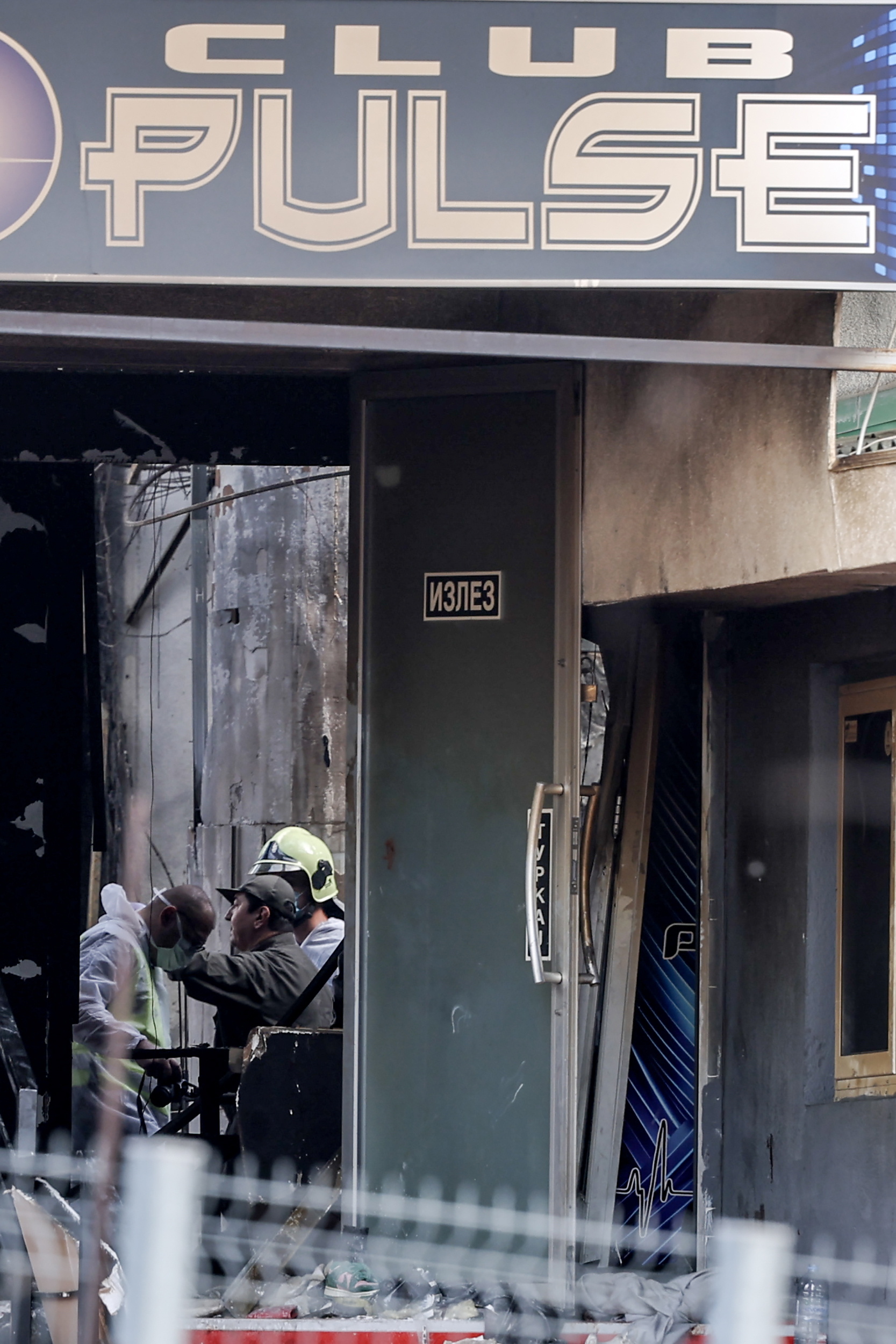 Investigators at the scene of a nightclub fire in Kocani, North Macedonia.