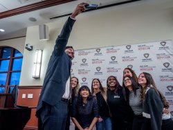 A group of Montclair faculty and students and Montclair Township Mayor Renee Baskerville pose for a selfie taken by President Jonathan Koppell.