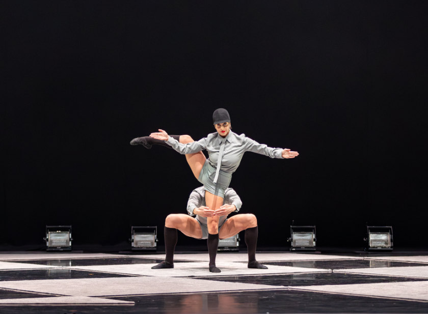 Two dancers in equestrian costume