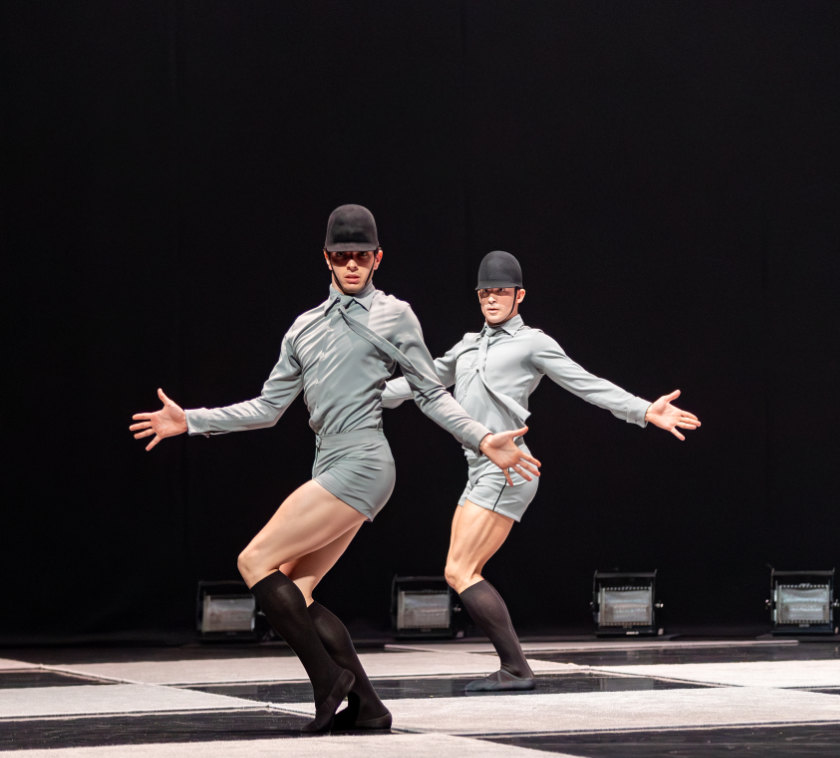 Two dancers in equestrian costume